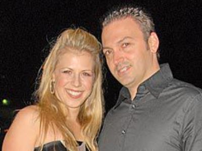 Cody Herpin is wearing a black shirt and Jodie Sweetin is wearing a sleeveless dress.